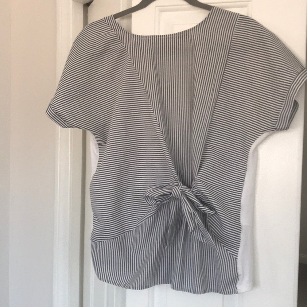 Cotton top with tee shirt material back British size 12 so it’s us 8 excellent